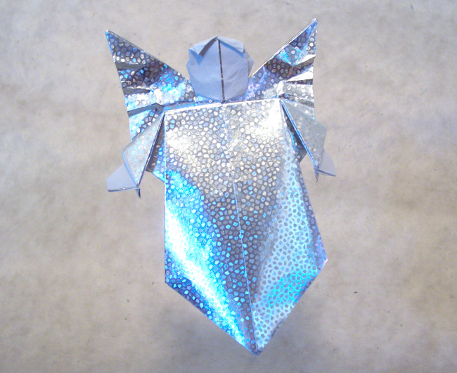 Origami Angel by Fernando Gilgado Gomez. Folded from a square of holographic origami paper by Gilad Aharoni on giladorigami.com