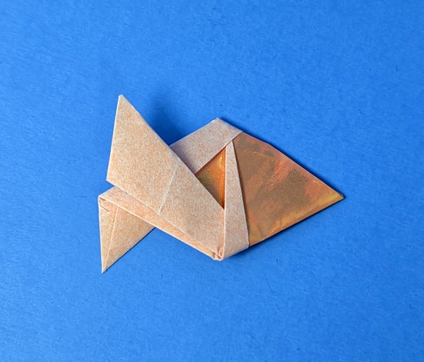 Origami Fish by Steven Casey Folded from a rectangle of holographic origami paper by Gilad Aharoni on www.giladorigami.com