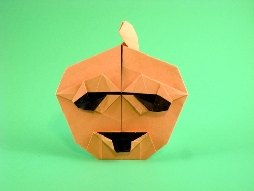 Origami Jack-o'-lantern by Deborah Claypool. Folded from a square of duo origami paper by Gilad Aharoni on giladorigami.com