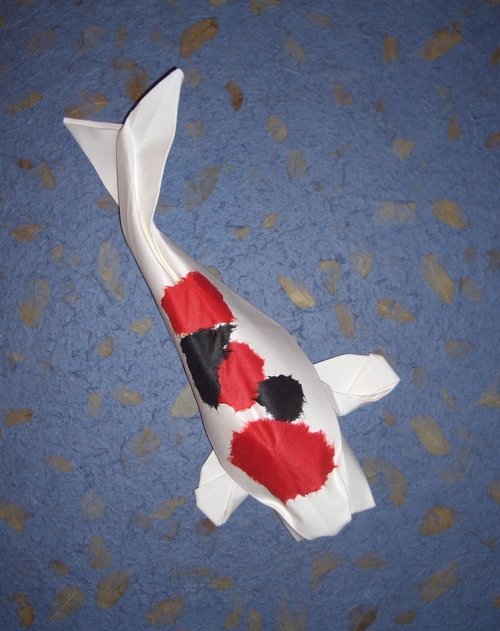 Origami Koi by Michael G. LaFosse. Wet-folded from a square of very heavy art-paper, with application of colored paper for the spots by Gilad Aharoni on giladorigami.com