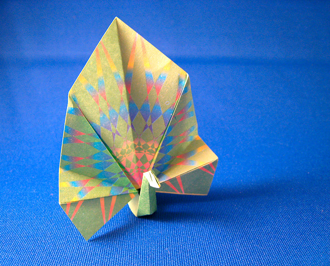 Origami Peacock by Kunihiko Kasahara. Folded from a square of patterned origami paper by Gilad Aharoni on giladorigami.com