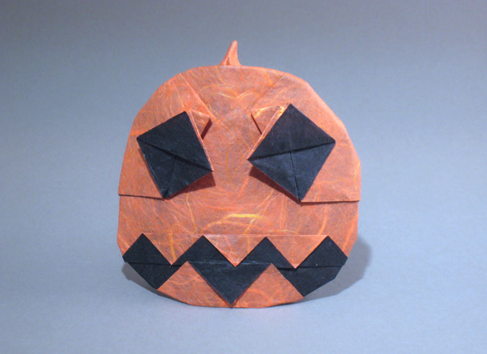Origami Jack-o'-lantern by Andrew Hudson. Folded from a square of double-sided Unryu paper by Gilad Aharoni on giladorigami.com