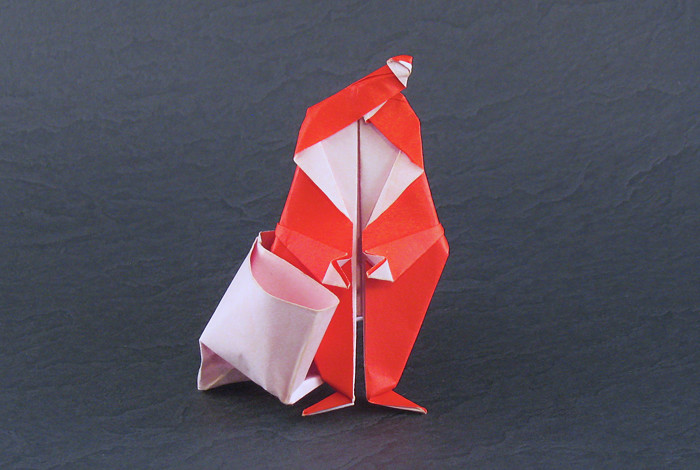 Origami Santa Claus with sack by David Brill. Folded from a rectangle of origami paper by Gilad Aharoni on giladorigami.com