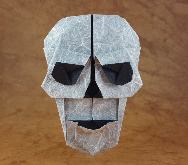 Origami Skull by Steven Casey. Folded from a square of Duo Thai paper by Gilad Aharoni on giladorigami.com