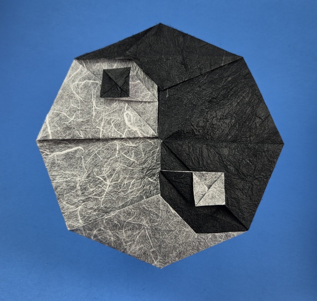 Origami Yin Yang by Steven Casey. Folded from a square of Duo Thai origami paper by Gilad Aharoni on giladorigami.com